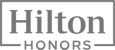The image features the Hilton Honors logo, a loyalty program of Hilton Hotels.