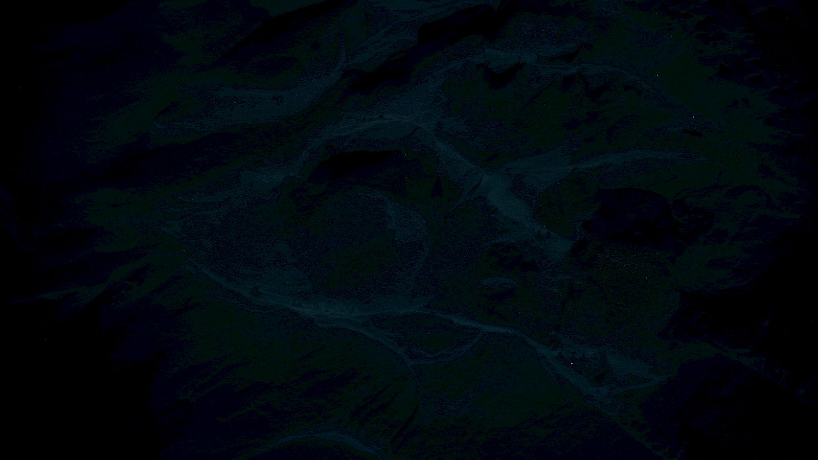 The image appears very dark and unclear, making it difficult to identify specific features or subjects.